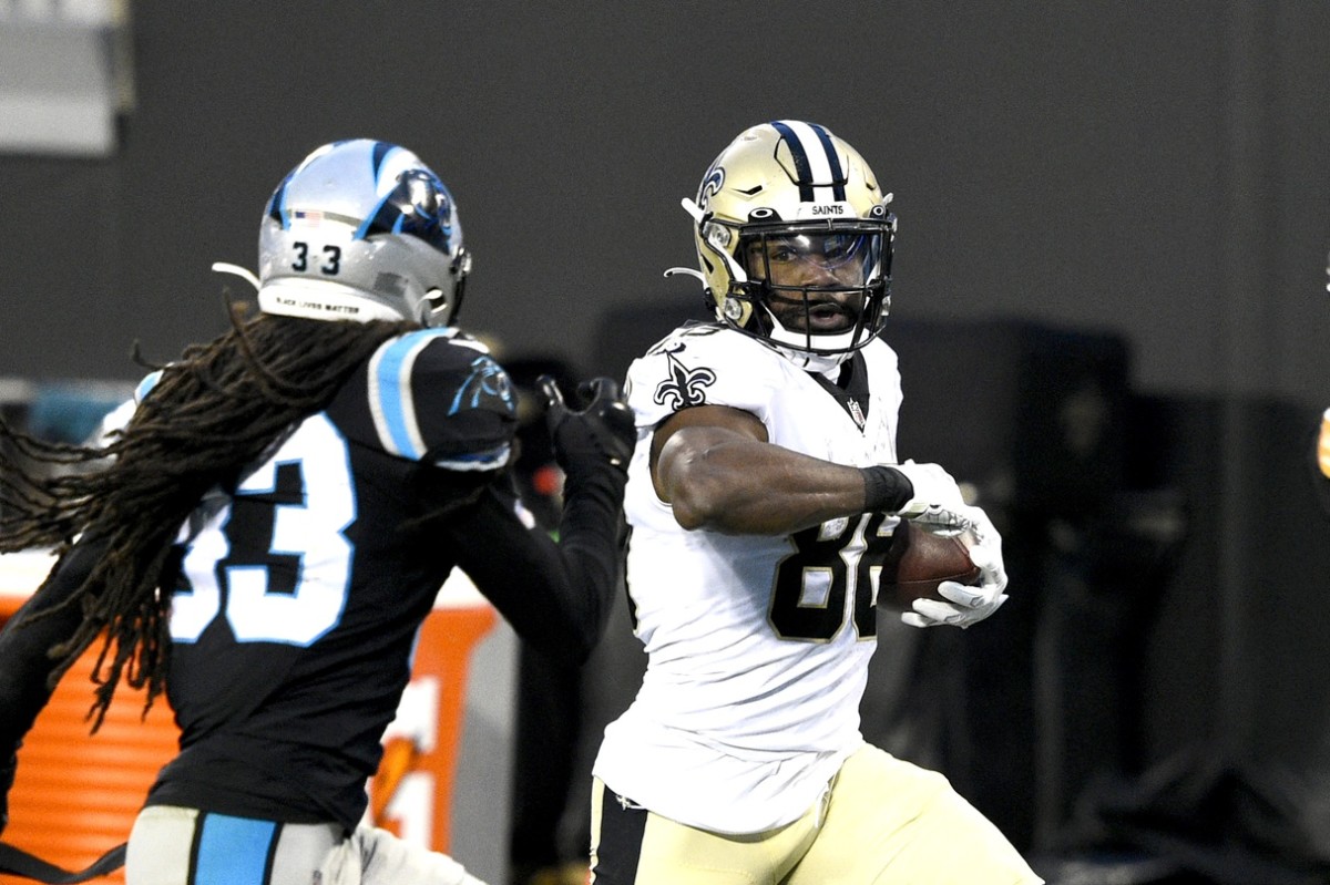 New Orleans running back Ty Montgomery (88) with the ball as Carolina safety Tre Boston (33) defends. Mandatory Credit: Bob Donnan-USA TODAY 